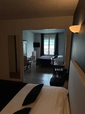 Un ou plusieurs lits dans un hébergement de l'établissement Hotel du Pot d'Etain