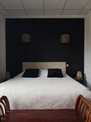 Un ou plusieurs lits dans un hébergement de l'établissement Hotel du Pot d'Etain