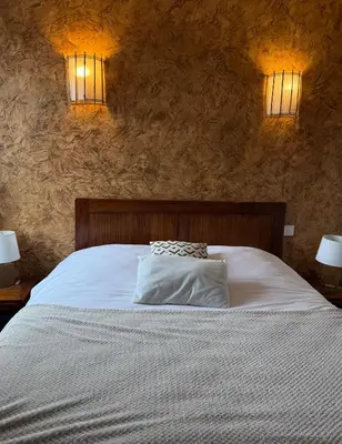 Un ou plusieurs lits dans un hébergement de l'établissement Hotel du Pot d'Etain