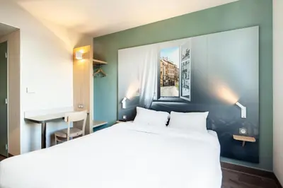 Un ou plusieurs lits dans un hébergement de l'établissement B&B HOTEL Meaux