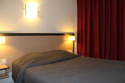 Un ou plusieurs lits dans un hébergement de l'établissement Hôtel de la Meuse