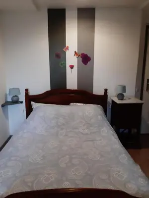 Un ou plusieurs lits dans un hébergement de l'établissement Chambre D'Hôtes avec petit Déjeuner