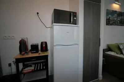 Cuisine ou kitchenette dans l'établissement Comme à la Maison - CENTRE-VILLE
