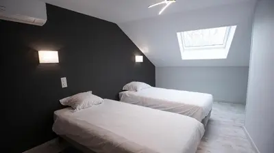 Un ou plusieurs lits dans un hébergement de l'établissement Maison Souply