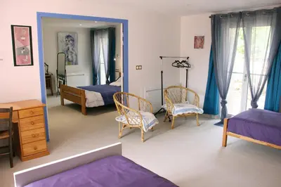 Un ou plusieurs lits dans un hébergement de l'établissement Chambres d'hôtes de la Fontaine