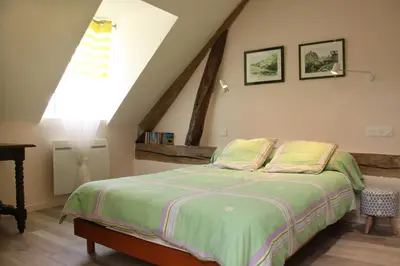 Un ou plusieurs lits dans un hébergement de l'établissement Chambres d'hôtes de la Fontaine