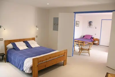 Un ou plusieurs lits dans un hébergement de l'établissement Chambres d'hôtes de la Fontaine