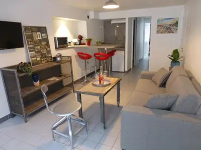 Coin salon dans l'établissement Cottage AU TERMINUS