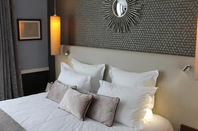 Un ou plusieurs lits dans un hébergement de l'établissement Hotel Maison Lia