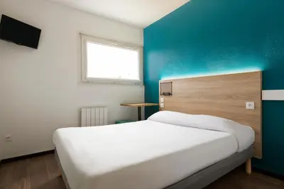 Un ou plusieurs lits dans un hébergement de l'établissement Hôtel F1 Reims Tinqueux