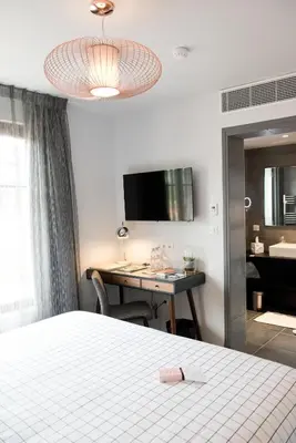 Un ou plusieurs lits dans un hébergement de l'établissement Armes de Champagne Hôtel & Spa