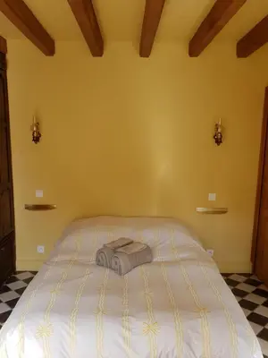 Un ou plusieurs lits dans un hébergement de l'établissement Gîte Le Relais Coq'Lys