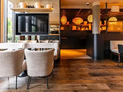 Télévision ou salle de divertissement dans l'établissement Novotel Suites Reims Centre