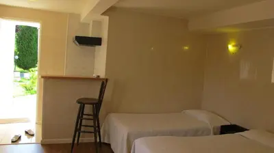 Un ou plusieurs lits dans un hébergement de l'établissement Hôtel Acostel