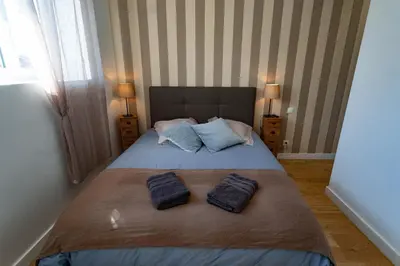 Un ou plusieurs lits dans un hébergement de l'établissement Domaine du Vendangeoir - Les Chambres