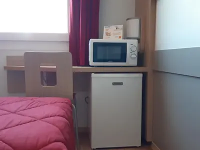 Cuisine ou kitchenette dans l'établissement Premiere Classe Reims Nord - Bétheny