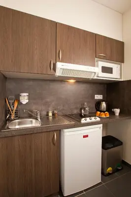 Cuisine ou kitchenette dans l'établissement Residhome Reims Centre