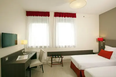 Télévision ou salle de divertissement dans l'établissement Residhome Reims Centre