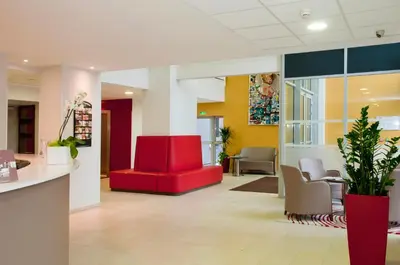 Coin salon dans l'établissement Residhome Reims Centre