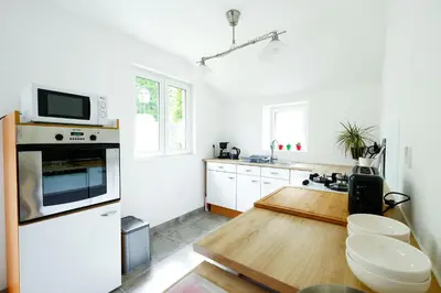 Cuisine ou kitchenette dans l'établissement La Maison du Parc Affaires et Tourisme