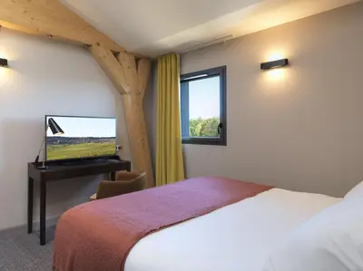 Un ou plusieurs lits dans un hébergement de l'établissement Hôtel Restaurant Les Grains d'Argent Dizy - Epernay