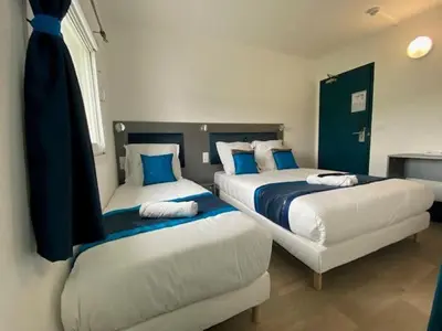 Un ou plusieurs lits dans un hébergement de l'établissement Fasthotel Soissons Nord