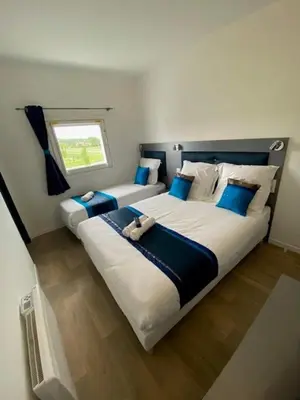 Un ou plusieurs lits dans un hébergement de l'établissement Fasthotel Soissons Nord
