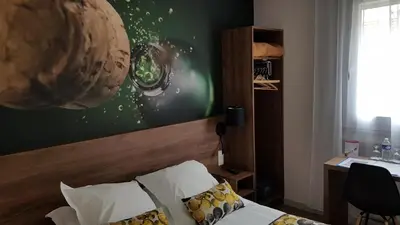 Un ou plusieurs lits dans un hébergement de l'établissement Hotel de Champagne