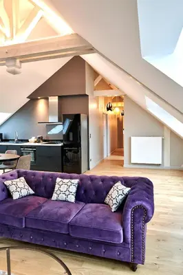 Coin salon dans l'établissement L'appartement et les Suites de VJL...