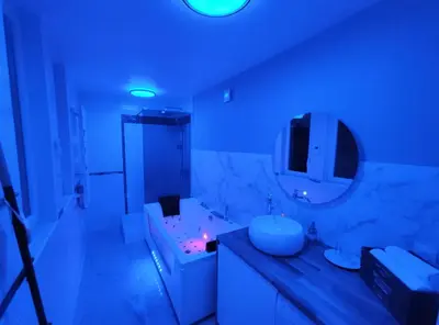 Un ou plusieurs lits dans un hébergement de l'établissement Groom Epernay - Jacuzzi & Champagne