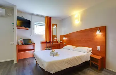 Un ou plusieurs lits dans un hébergement de l'établissement Brit Hotel Reims La Pompelle