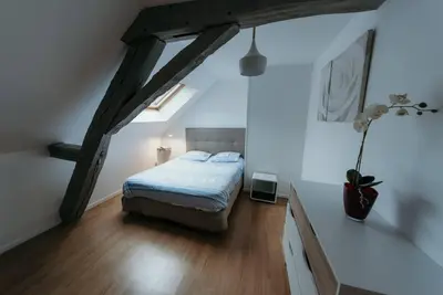Un ou plusieurs lits dans un hébergement de l'établissement Appartement de Romain
