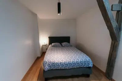 Un ou plusieurs lits dans un hébergement de l'établissement Appartement de Romain
