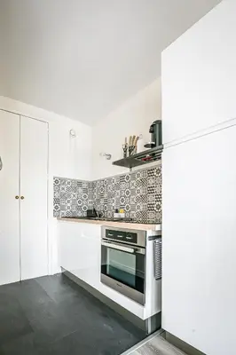 Cuisine ou kitchenette dans l'établissement Le Septième - Vue cathédrale - Saint Rémi