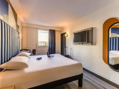 Télévision ou salle de divertissement dans l'établissement ibis Styles Saint-Quentin