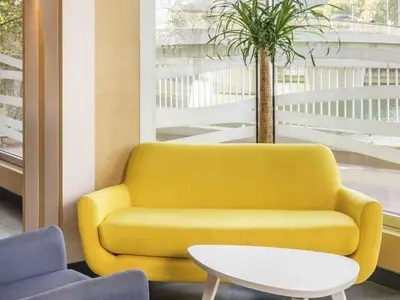 Coin salon dans l'établissement ibis Styles Meaux Centre