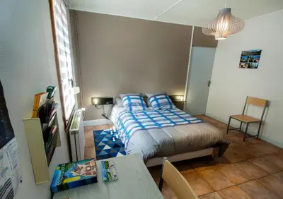 Un ou plusieurs lits dans un hébergement de l'établissement GÎTE Le Moulineau
