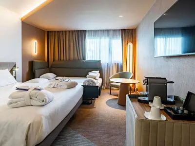 Un ou plusieurs lits dans un hébergement de l'établissement Novotel Reims Tinqueux