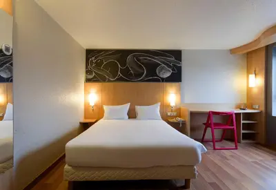 Un ou plusieurs lits dans un hébergement de l'établissement B&B HOTEL Reims Centre Erlon