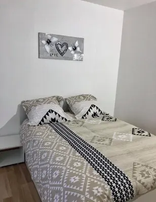 Un ou plusieurs lits dans un hébergement de l'établissement Appartement Aventure à Épernay