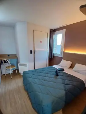 Un ou plusieurs lits dans un hébergement de l'établissement Premiere Classe Compiegne - Jaux