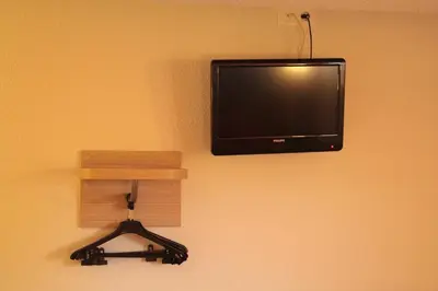 Télévision ou salle de divertissement dans l'établissement Premiere Classe Soissons