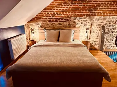 Un ou plusieurs lits dans un hébergement de l'établissement Le Loft