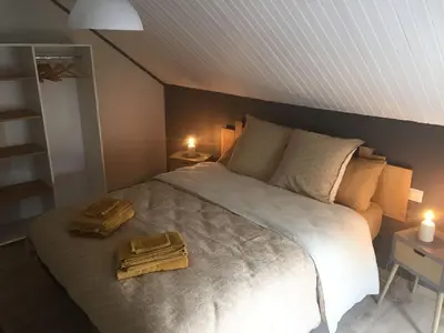 Un ou plusieurs lits dans un hébergement de l'établissement Gîte 8 à 14 personnes en Champagne avec jacuzzi