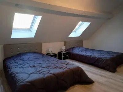 Un ou plusieurs lits dans un hébergement de l'établissement duplex agréable et calme