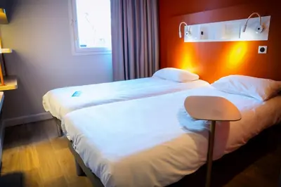 Un ou plusieurs lits dans un hébergement de l'établissement ibis budget Reims Parc Des Expositions