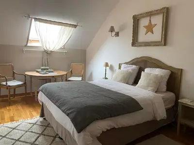 Un ou plusieurs lits dans un hébergement de l'établissement Chambres d hôtes La Suite du 12