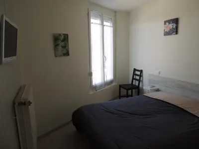 Un ou plusieurs lits dans un hébergement de l'établissement Hotel Le Colbert epernay