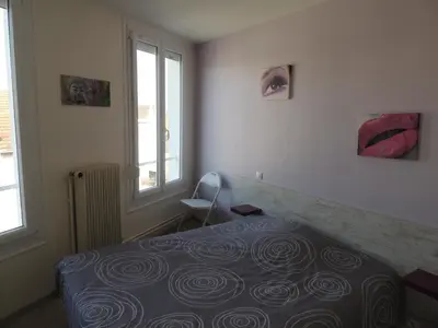 Un ou plusieurs lits dans un hébergement de l'établissement Hotel Le Colbert epernay