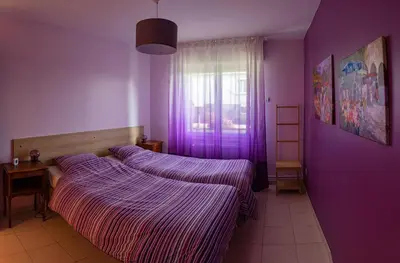 Un ou plusieurs lits dans un hébergement de l'établissement Paisible Maison entière 140m2 avec véranda vue sur la campagne